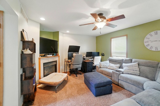 1820 Bishop Ln, Findlay, OH 45840 - carpeted living area with a ceiling fan, a tiled fireplace, recessed lighting, and a desk