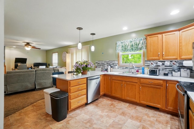 1820 Bishop Ln, Findlay, OH 45840 - kitchen with appliances with stainless steel finishes, a sink, a peninsula, backsplash, and ceiling fan