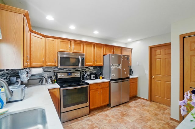 1820 Bishop Ln, Findlay, OH 45840 - kitchen featuring stainless steel appliances, light countertops, backsplash, and recessed lighting