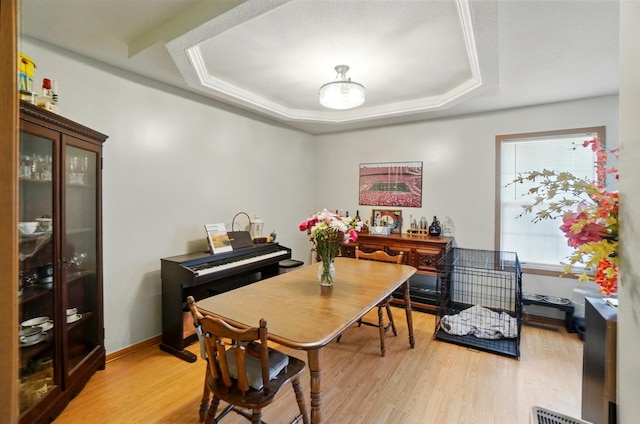1820 Bishop Ln, Findlay, OH 45840 - dining area featuring light wood-type flooring and a tray ceiling