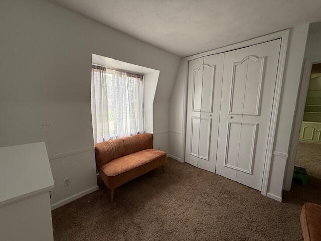 1337 Stratford Dr, Piqua, OH 45356 - living area with carpet floors and baseboards