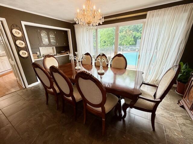 1337 Stratford Dr, Piqua, OH 45356 - dining space with a chandelier and crown molding