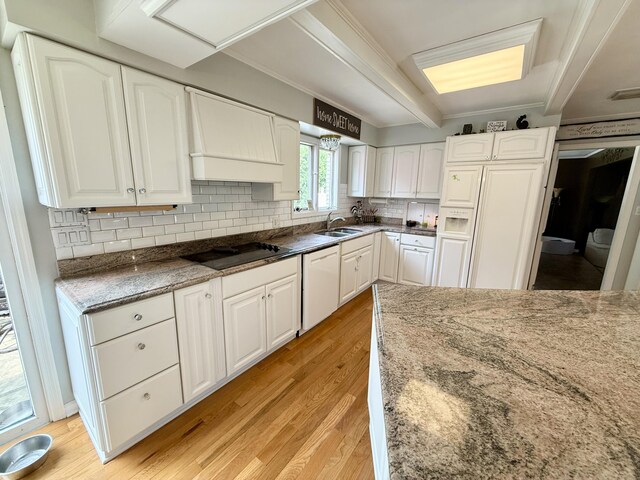 1337 Stratford Dr, Piqua, OH 45356 - kitchen featuring white dishwasher, light wood-style flooring, white cabinets, decorative backsplash, and ornamental molding