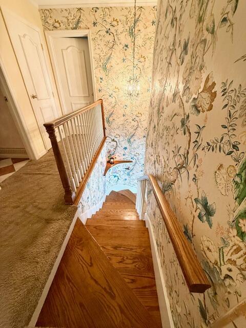 1337 Stratford Dr, Piqua, OH 45356 - stairway featuring wallpapered walls and baseboards