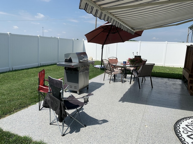 11532 State Route 235, Lakeview, OH 43331 - fenced backyard with area for grilling, outdoor dining space, and a patio