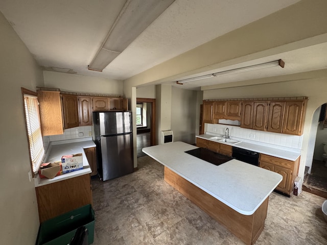 1108 N Fountain Blvd, Springfield, OH 45504 - kitchen with black appliances, tasteful backsplash, and light countertops