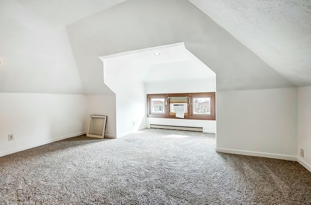 bonus room featuring vaulted ceiling, baseboard heating, carpet flooring, and baseboards