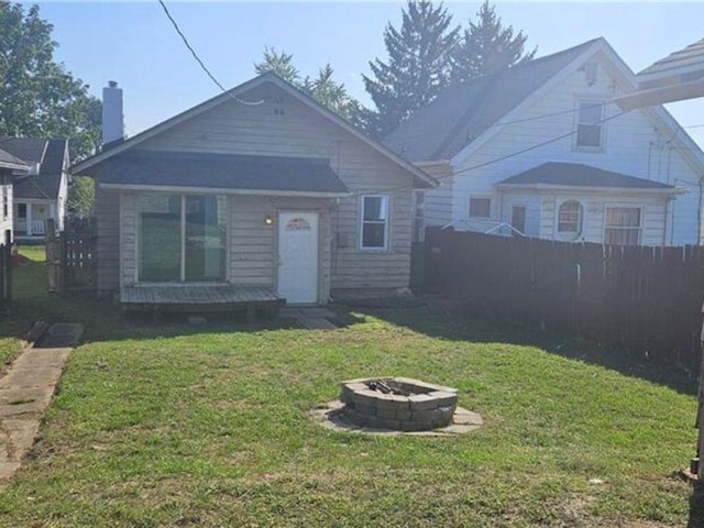 1639 Gondert Ave, Dayton, OH 45403 - bungalow-style house featuring a fire pit and a chimney