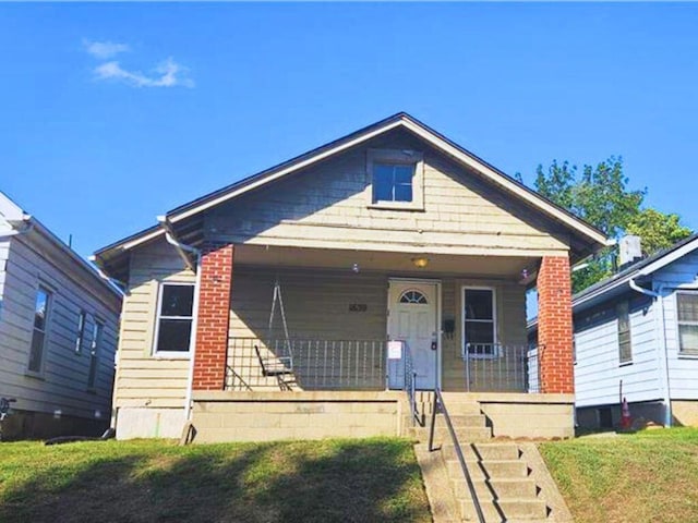 1639 Gondert Ave, Dayton, OH 45403 - view of front of property with covered porch and a front yard