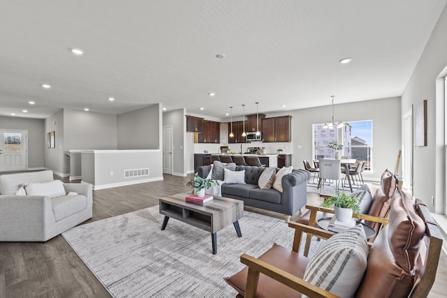 1304 Township Rd Unit 179, Bellefontaine, OH 43311 - living room featuring visible vents, recessed lighting, baseboards, and wood finished floors