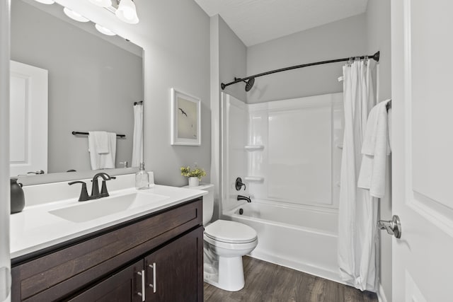 1304 Township Rd Unit 179, Bellefontaine, OH 43311 - bathroom with toilet, vanity, shower / tub combo, wood finished floors, and a textured ceiling