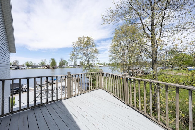 wooden deck featuring a water view