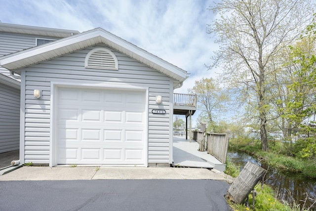 detached garage with aphalt driveway