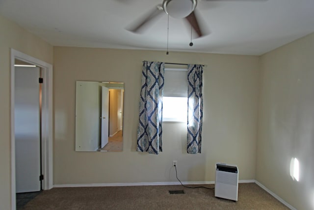 carpeted empty room with ceiling fan