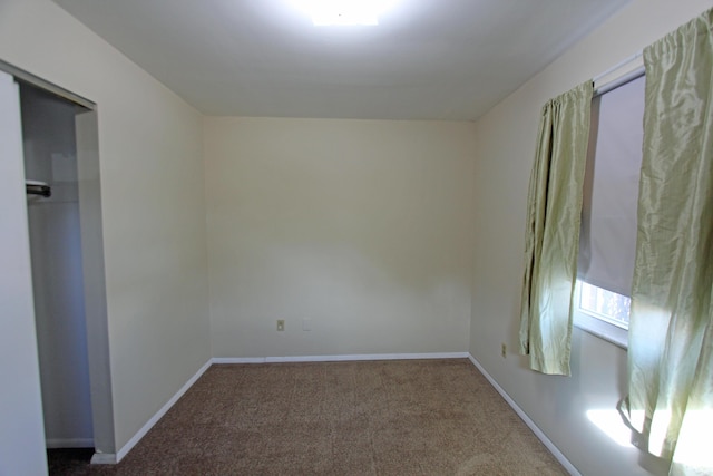 empty room with carpet flooring