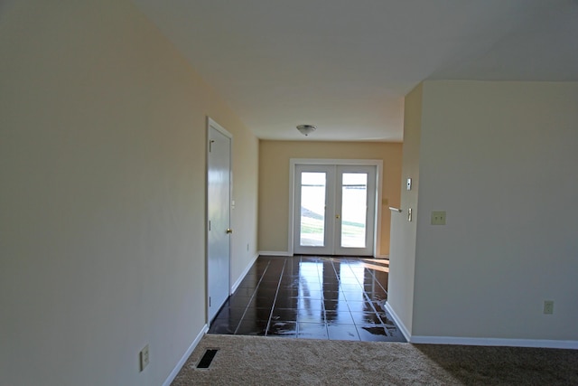 doorway with french doors and dark colored carpet