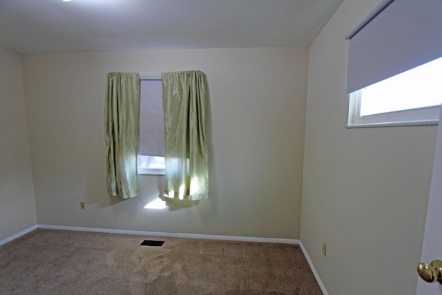 unfurnished room with carpet floors