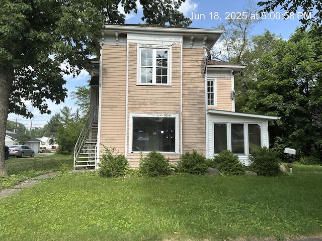 542 N Main St, Ada, OH 45810 - back of property with stairway and a lawn
