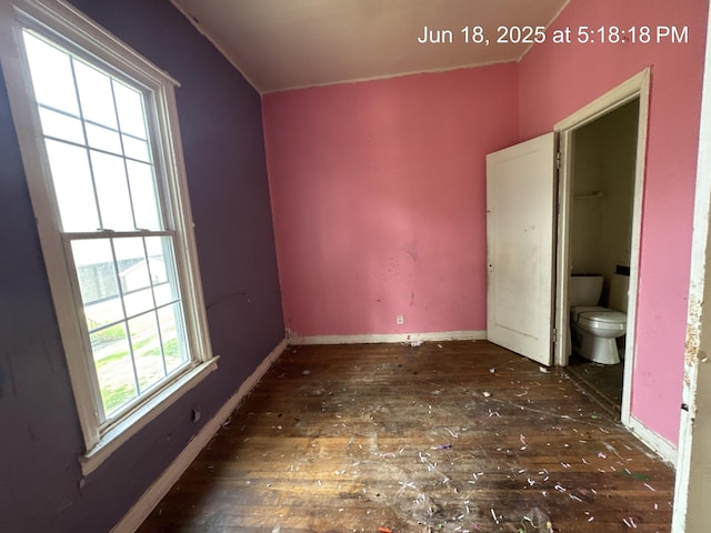 542 N Main St, Ada, OH 45810 - unfurnished bedroom featuring hardwood / wood-style flooring