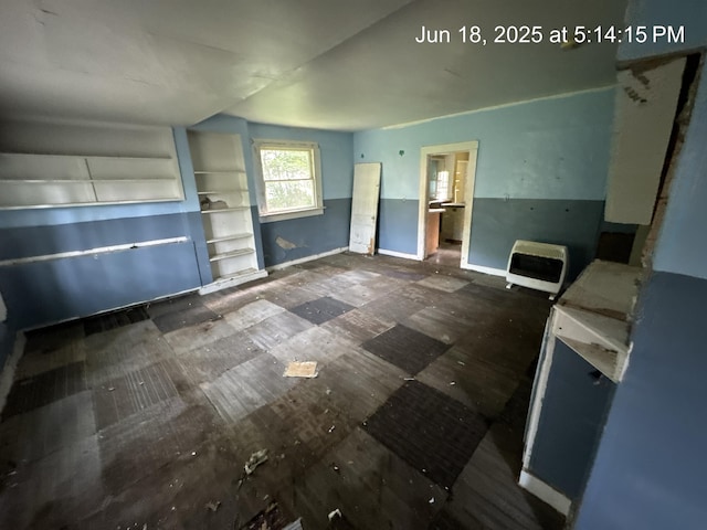 542 N Main St, Ada, OH 45810 - kitchen featuring heating unit and baseboards