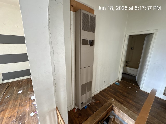 542 N Main St, Ada, OH 45810 - corridor with wood-type flooring and a heating unit