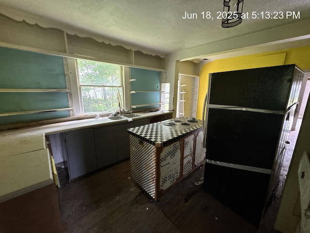 542 N Main St, Ada, OH 45810 - kitchen with a textured ceiling and dark wood-type flooring