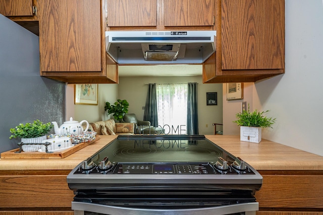4321 Frontenac Dr, Beavercreek, OH 45440 - kitchen featuring electric range, range hood, brown cabinetry, and light countertops