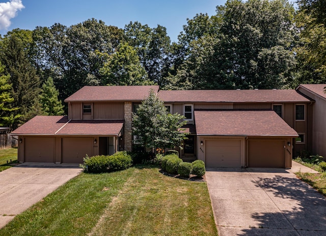 4321 Frontenac Dr, Beavercreek, OH 45440 - view of front of house featuring concrete driveway, a front lawn, and roof with shingles