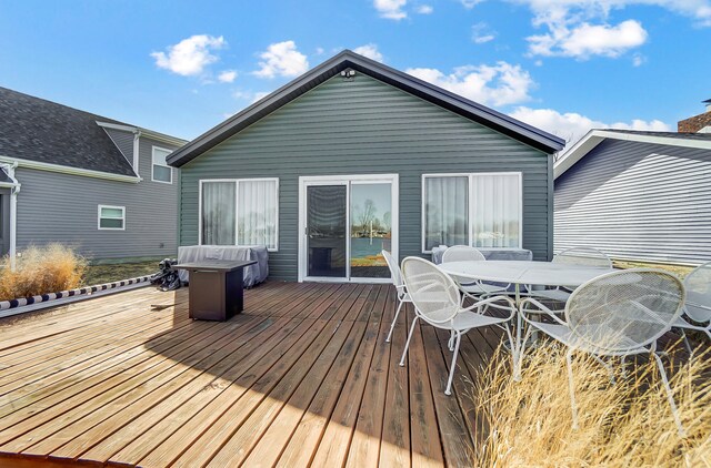7748 Walnut St, Russells Point, OH 43348 - deck with outdoor dining area and a grill