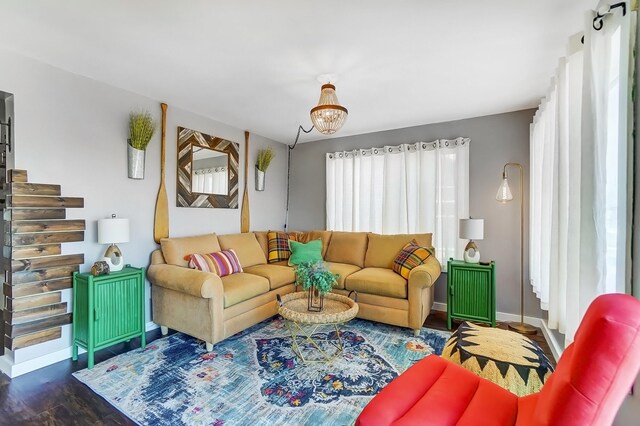 7748 Walnut St, Russells Point, OH 43348 - living area with stairs, dark wood-style floors, and baseboards