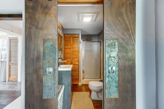 7748 Walnut St, Russells Point, OH 43348 - bathroom with vanity, a shower stall, and toilet