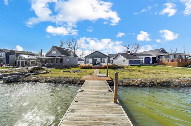 7748 Walnut St, Russells Point, OH 43348 - view of dock with a residential view, a lawn, and a water view
