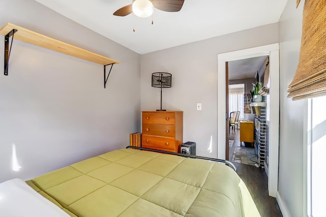 7748 Walnut St, Russells Point, OH 43348 - bedroom with ceiling fan and wood finished floors