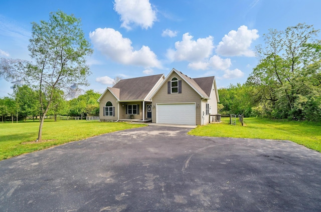 view of front facade featuring asphalt driveway and a front lawn