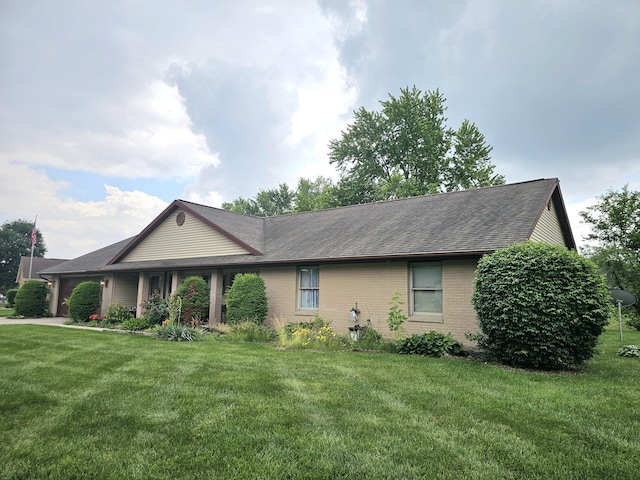 1308 Stonyridge Ave, Troy, OH 45373 - single story home featuring an attached garage, a front lawn, and roof with shingles