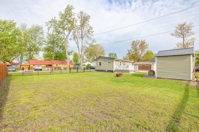 view of yard with an outbuilding and a fenced backyard