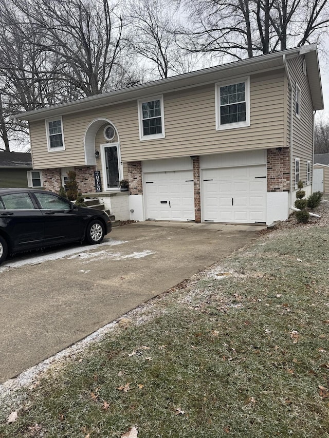 bi-level home featuring a garage