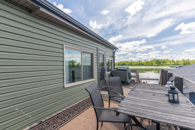 8886 State Route 368, Huntsville, OH 43324 - wooden terrace featuring a water view, outdoor dining space, and area for grilling