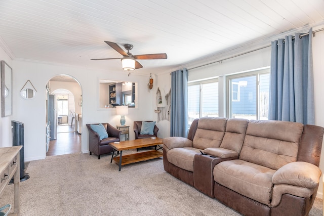 8886 State Route 368, Huntsville, OH 43324 - living area featuring light colored carpet, ceiling fan, ornamental molding, arched walkways, and baseboards