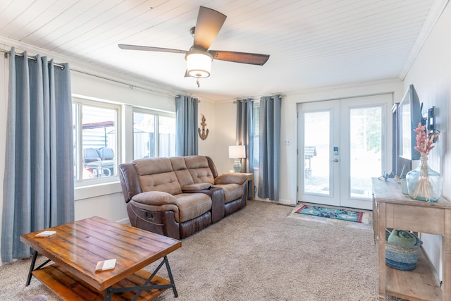 8886 State Route 368, Huntsville, OH 43324 - living area featuring french doors, healthy amount of natural light, ornamental molding, and light colored carpet