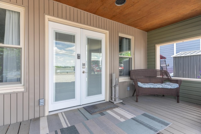 8886 State Route 368, Huntsville, OH 43324 - view of exterior entry with french doors and board and batten siding