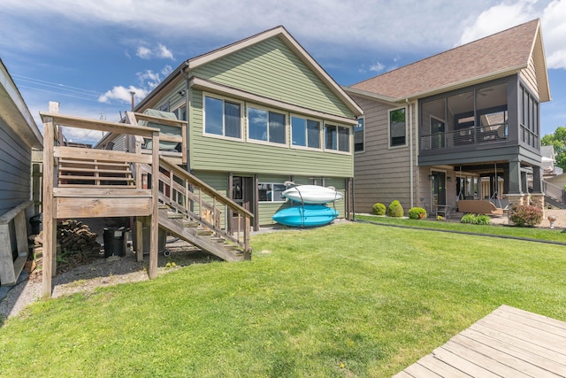 8886 State Route 368, Huntsville, OH 43324 - back of property with stairs, a yard, a wooden deck, and roof with shingles