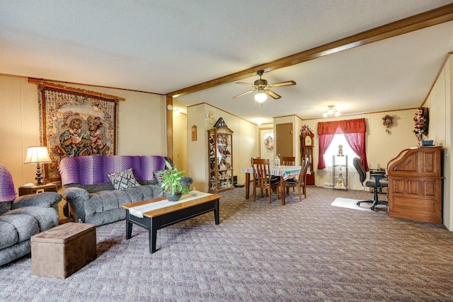 carpeted living area featuring a textured ceiling, a ceiling fan, beamed ceiling, and ornamental molding