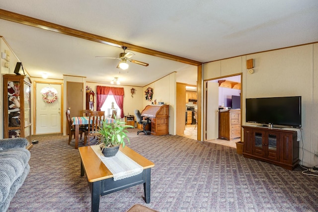 carpeted living room featuring vaulted ceiling with beams, ceiling fan, and crown molding