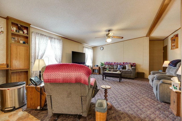 carpeted living room featuring a ceiling fan and a textured ceiling