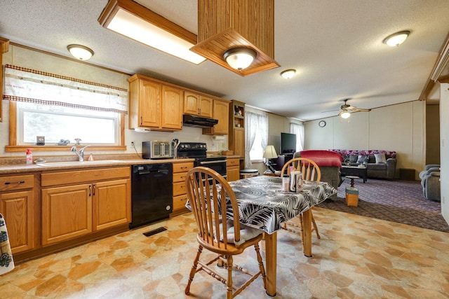 kitchen featuring open floor plan, a sink, a textured ceiling, under cabinet range hood, and black appliances