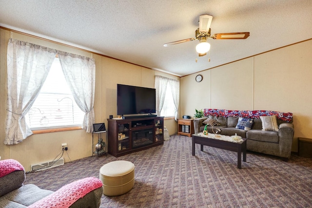 carpeted living area with ornamental molding, ceiling fan, and a textured ceiling