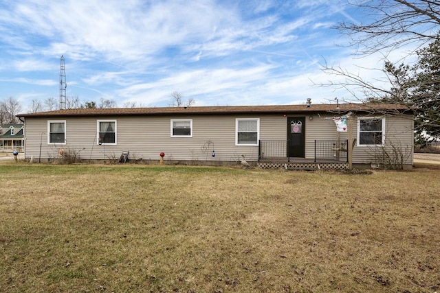 rear view of house featuring crawl space and a yard