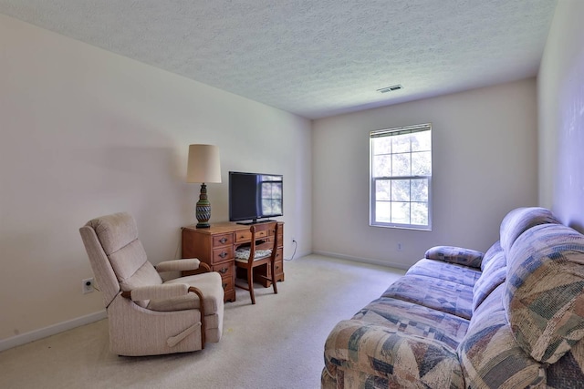 living room featuring a textured ceiling, visible vents, light carpet, and baseboards