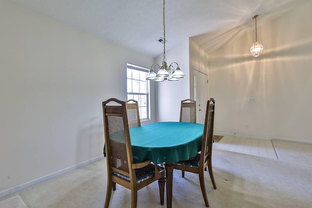 dining room featuring baseboards, light carpet, a chandelier, and visible vents